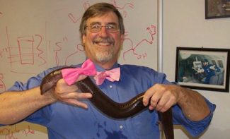 John Pojman holding a salamander