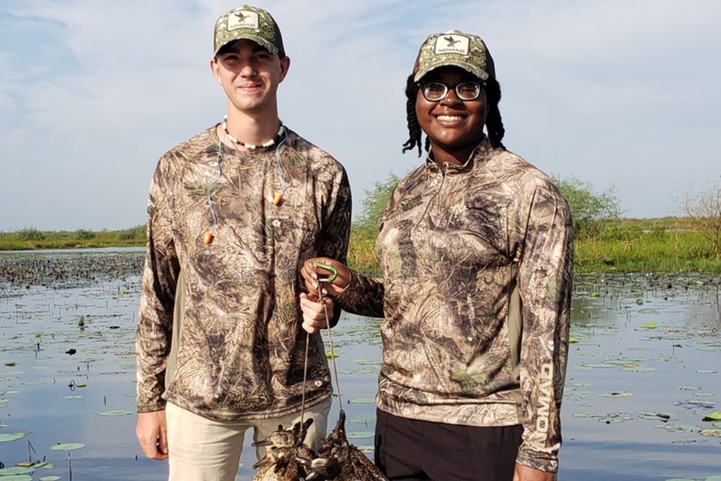 Undergraduate students participating in duck hunt field trip