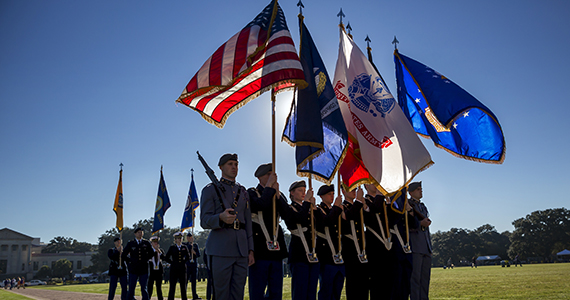 Photo of LSU military members presenting the flags on the LSU Parade Grounds for LSU salutes.
