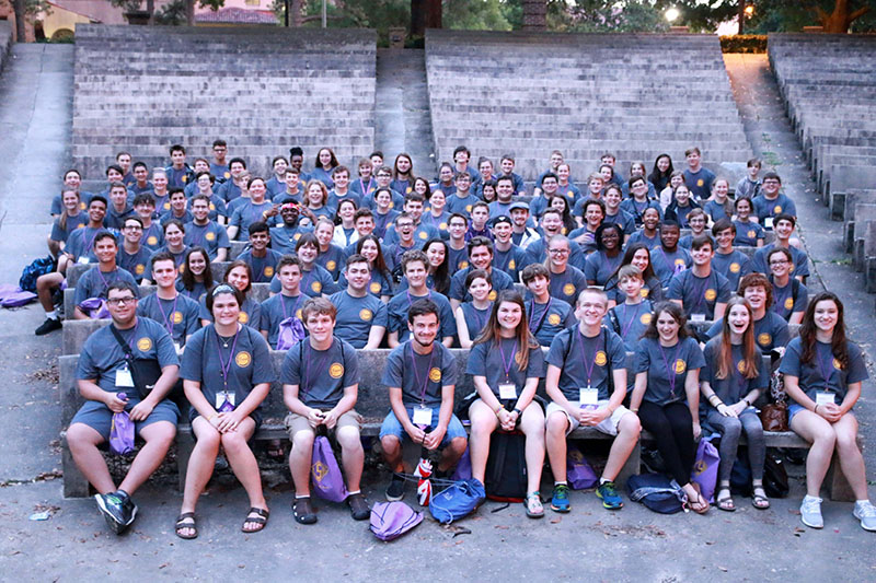 students posing for a photo in the greek theater