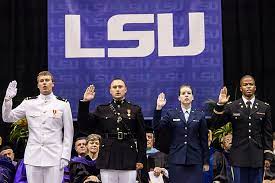 Four ROTC cadets are recognized at a LSU commencement ceremony.