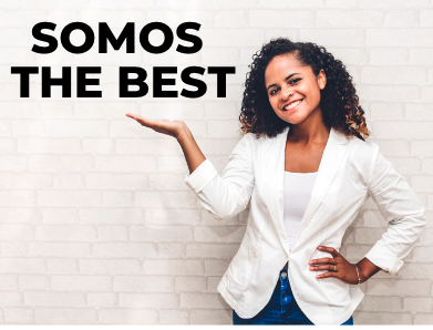 student with blazer holding up the words somos the best
