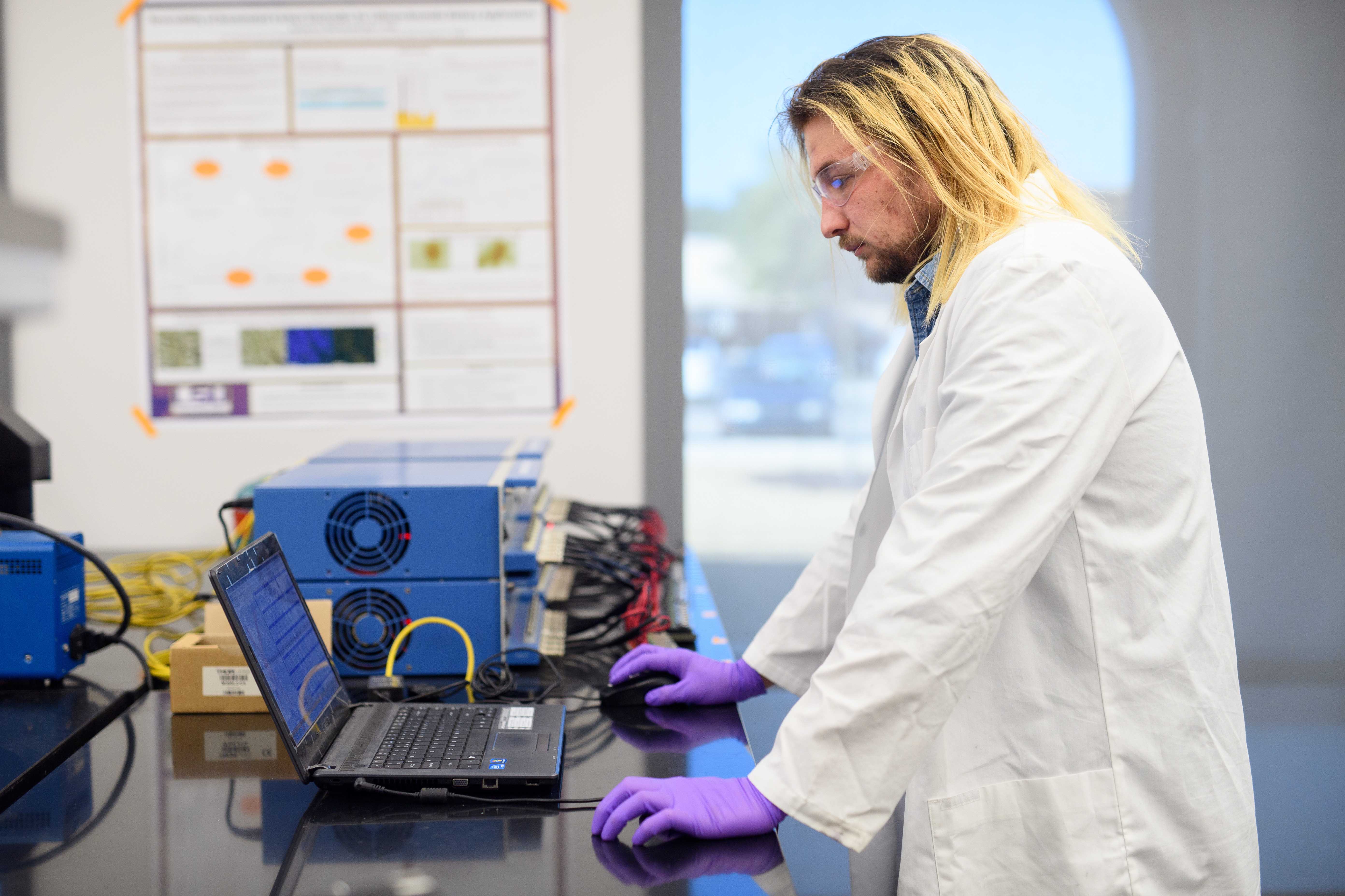 Ben Peterson at lab table