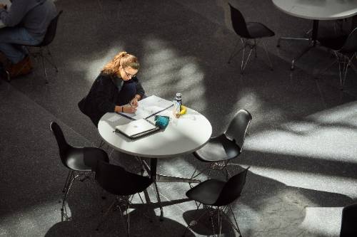 Female student sitting at table in PFT
