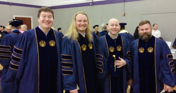 Four doctoral degree recipients on Commencement Day