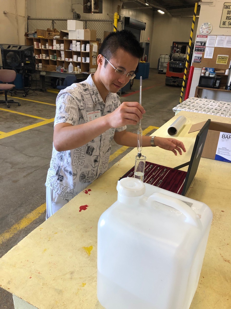 LSU graduate student Anthony Mai helps formulate hand sanitizer to combat coronavirus