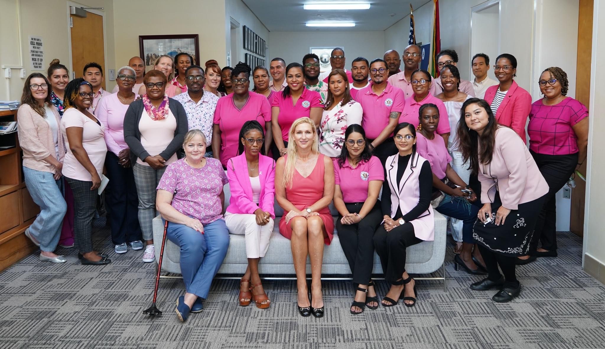 Nicole Theriot in group photo with women at cancer awareness event