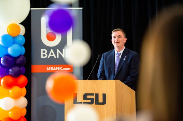 Student speaks at podium at b1BANK event