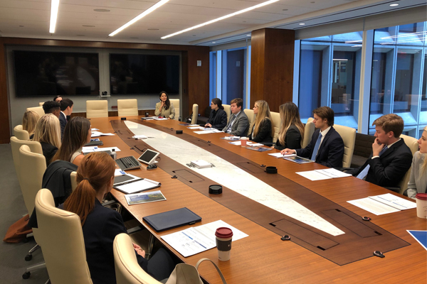 Students meet in a board room in NYC