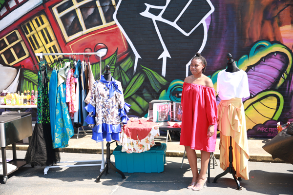 Vendor selling womens clothing in outdoor market