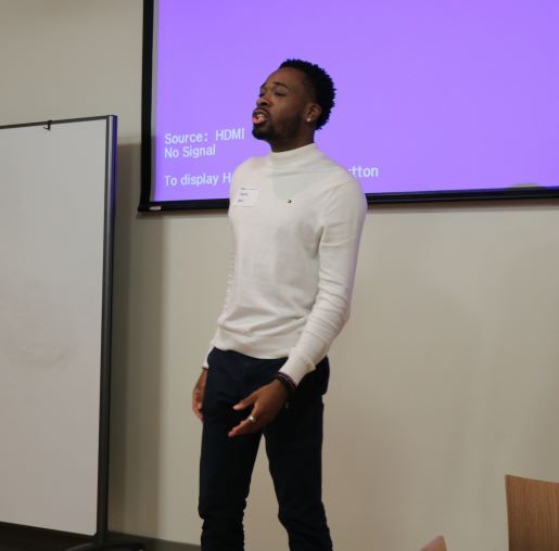 Student gives a pitch in front of the room