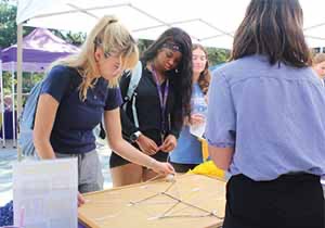 Students paying game at Academic Kick-Off table