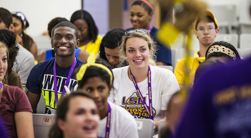 students smiling at a stripes event
